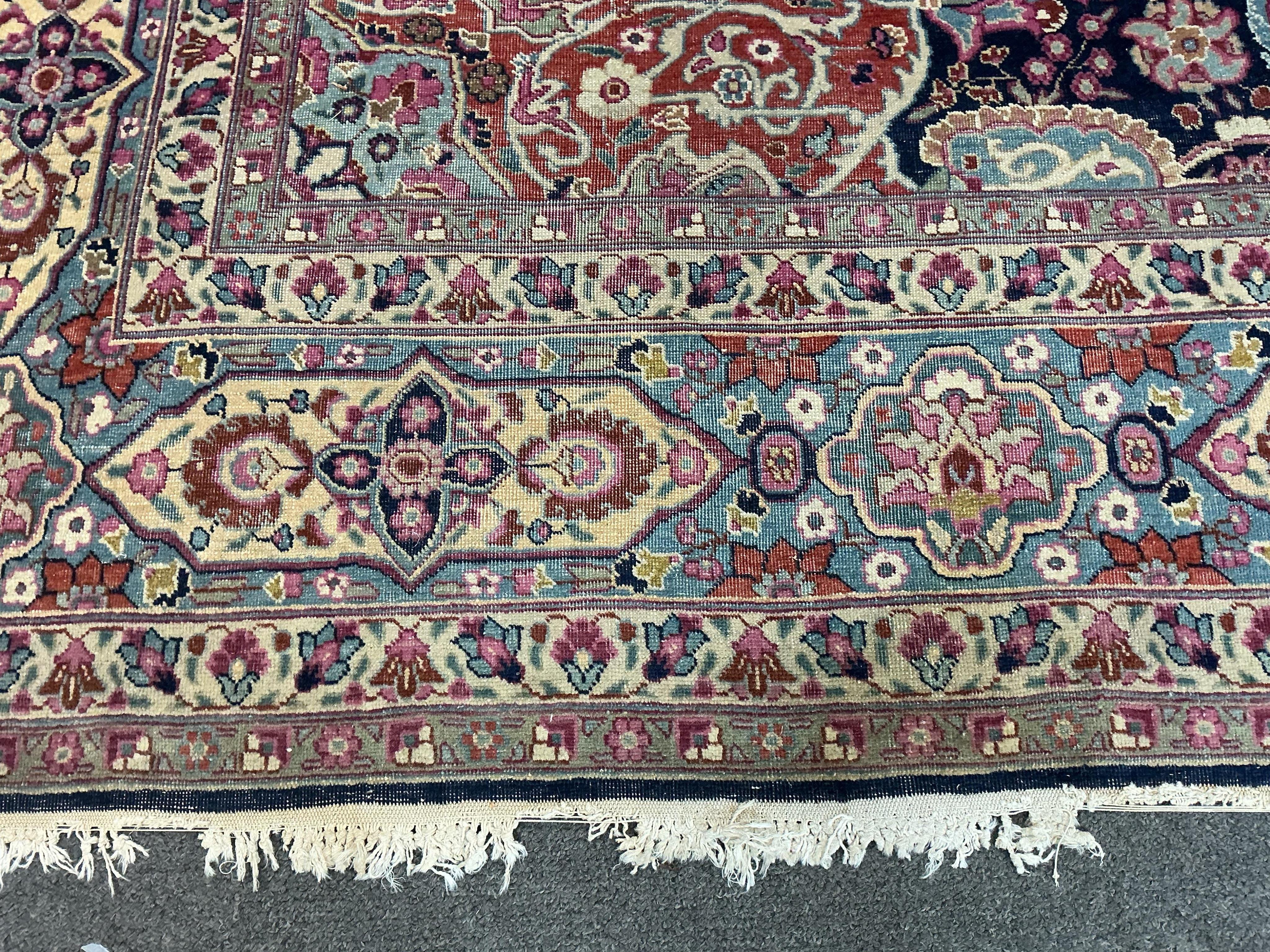 An early 20th century Kashan blue ground carpet, 315 x 206cm